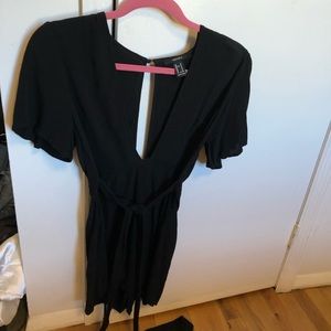 deep v black fancy romper with tie front!